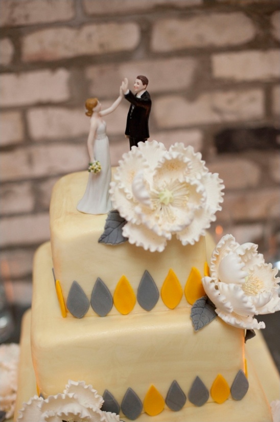 high fiving bride and groom cake topper