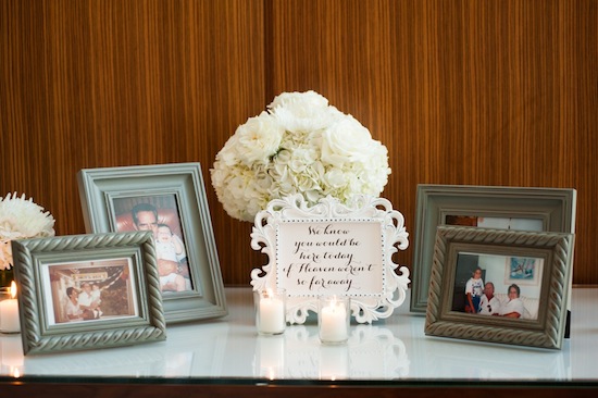 Memorial table with photos and message: We know youd be here