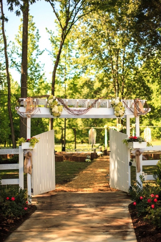 white gate at entrance to the wedding ceremony
