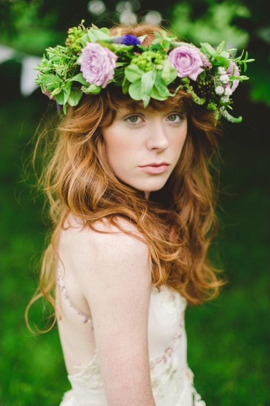 Redhead with floral crown wedding dress closeup