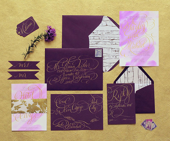 Elegant purple wedding invitation suite with gold calligraphy