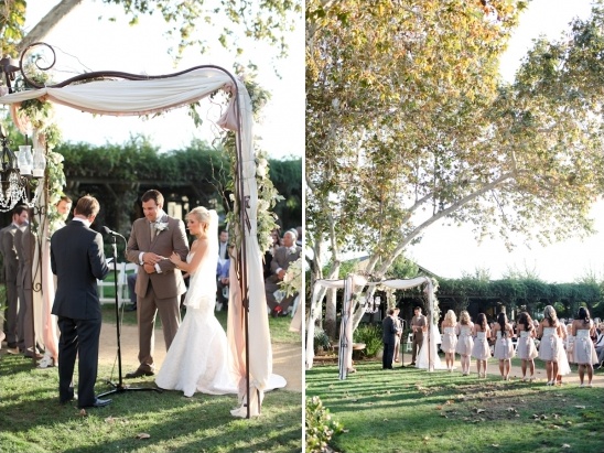 Outdoor wedding ceremony with arch and bridesmaids