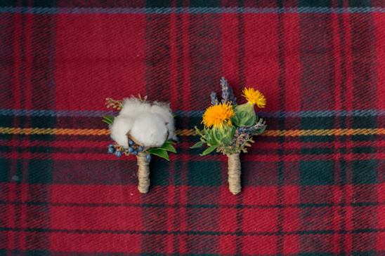 Floral boutonnieres on red plaid fabric