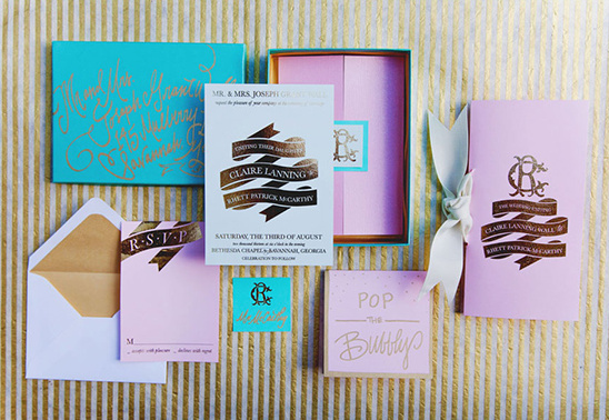 Elegant wedding invitation suite with pink and gold accents