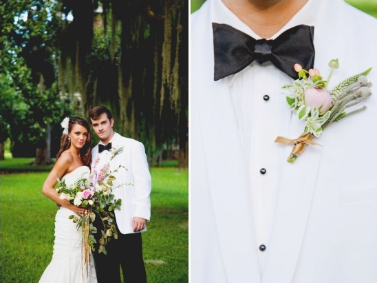 Bride and groom embrace with elegant wedding attire