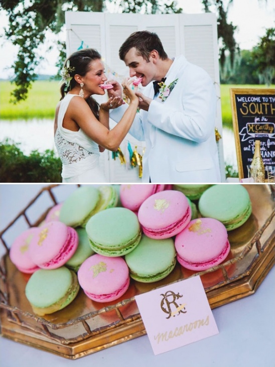Bride and groom share macarons at their wedding reception