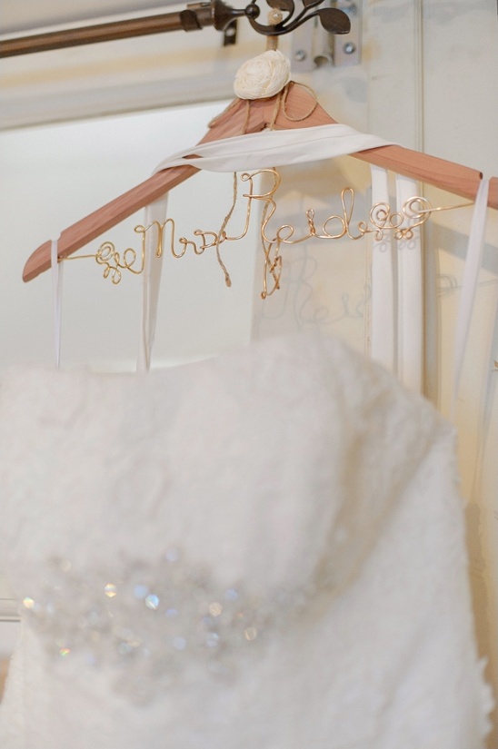 Wedding dress on hanger with Mrs Bride gold wire art
