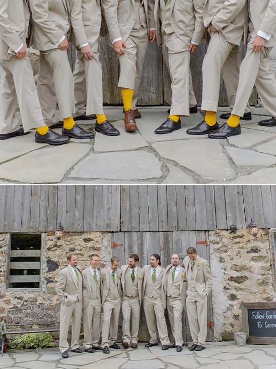 Groomsmen in suits with yellow socks and groomsmen at barn