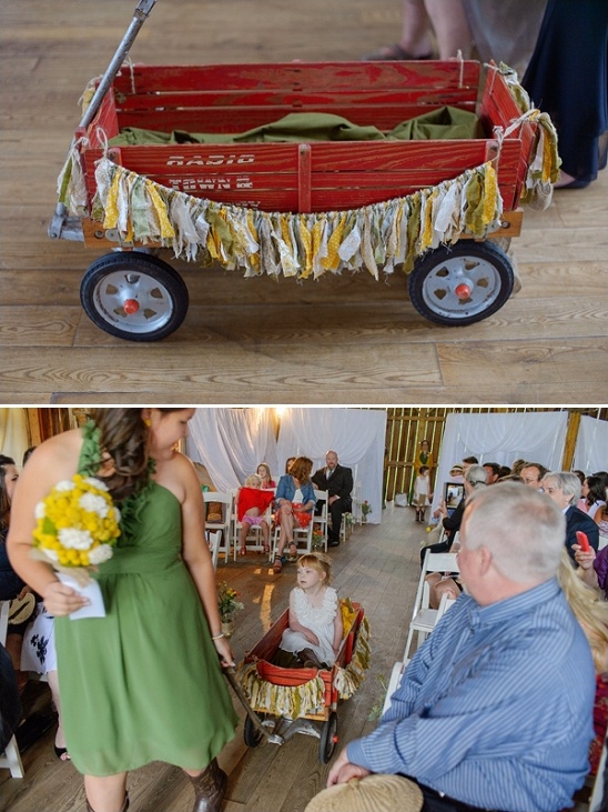 Rustic red wagon with burlap bunting at wedding