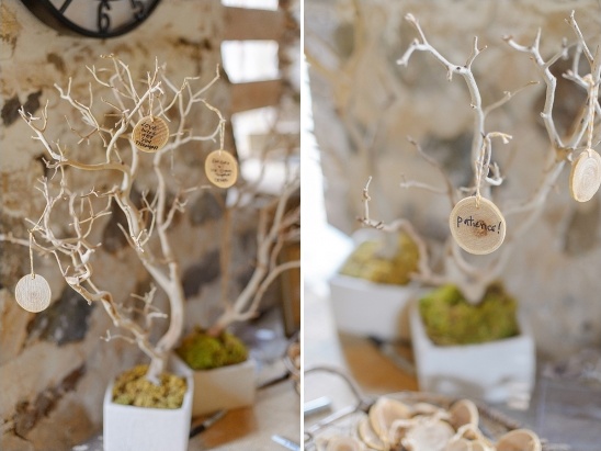 Wedding wish tree with handwritten messages on wood
