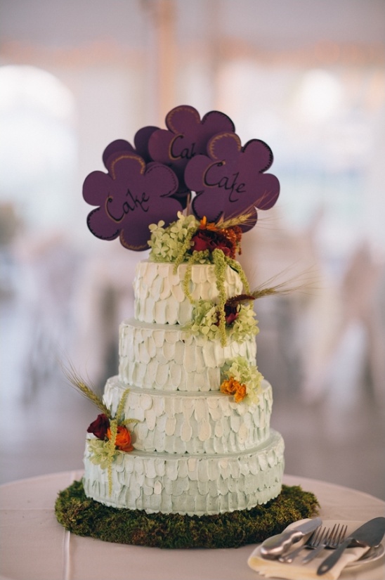 wedding cake with purple flower cake topper