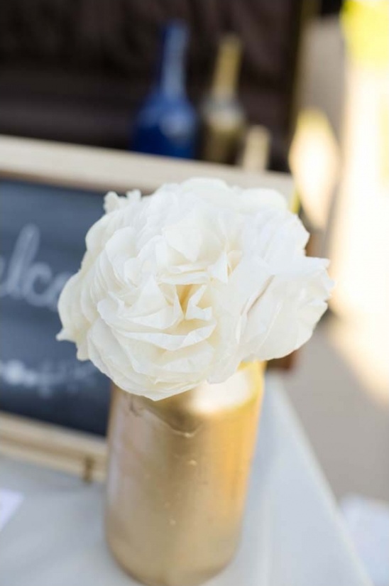 White flower in golden vase wedding centerpiece