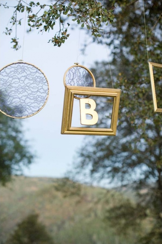 Hanging picture frames and lace decorations outdoors