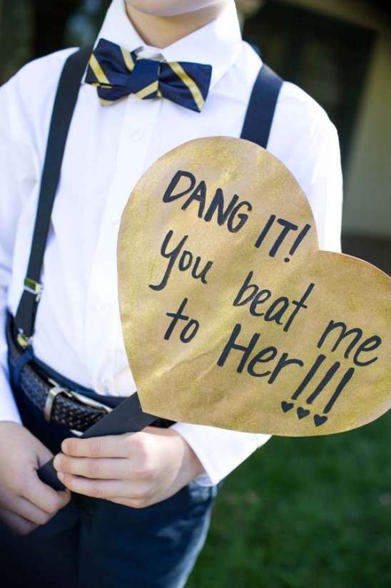 Boy holds heart sign: Dang it! You beat me to her!!!