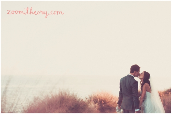 Bride and groom share a kiss on their wedding day
