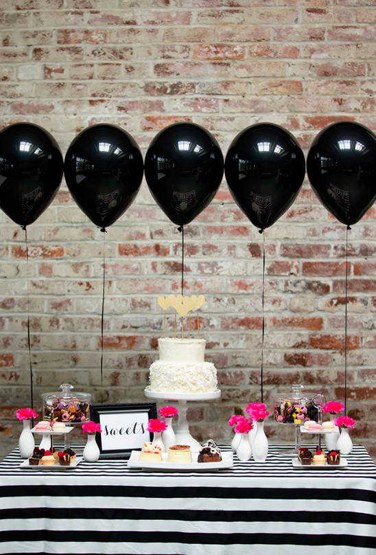 black and pink dessert table