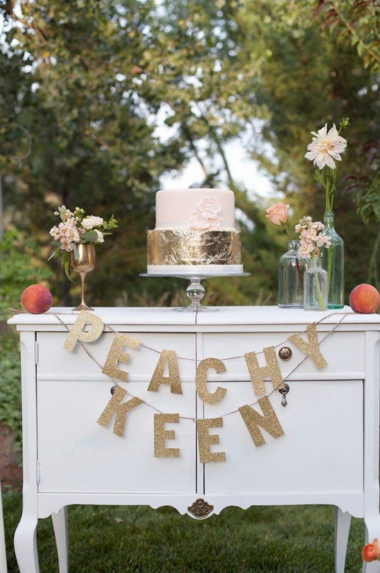 Peachy Keen wedding cake on white table outside
