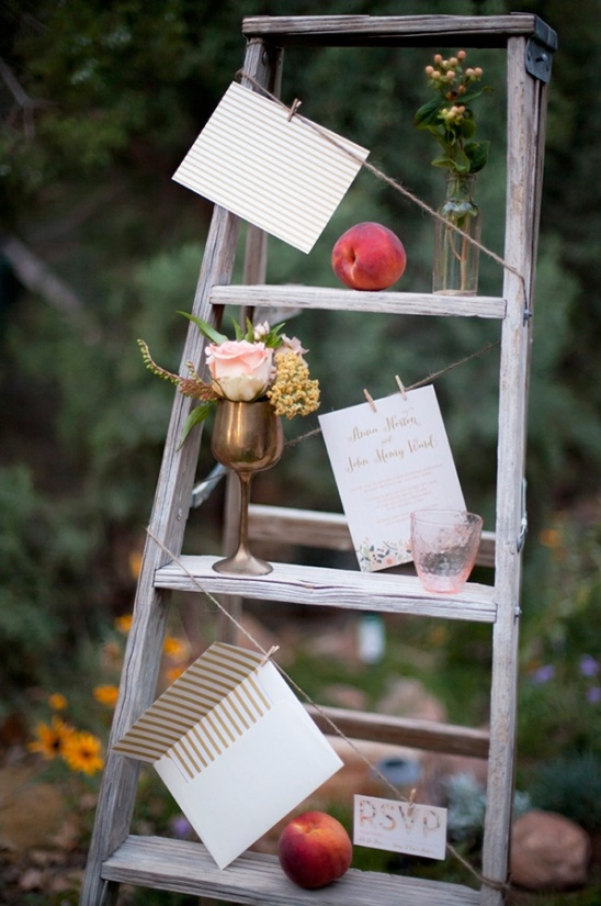 Ladder display of invitation cards and peaches
