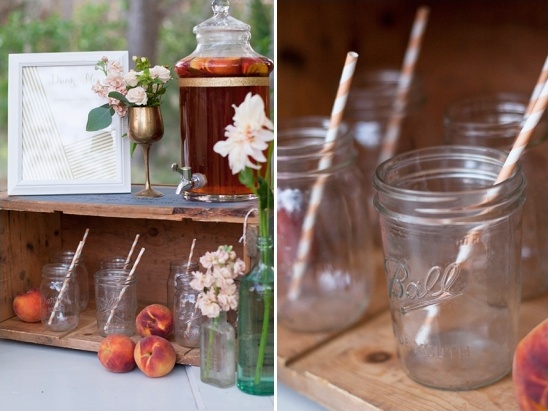 Rustic peach drink station with mason jars and flowers