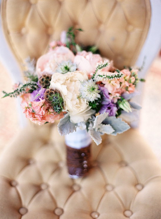 Beautiful pastel wedding bouquet on chair