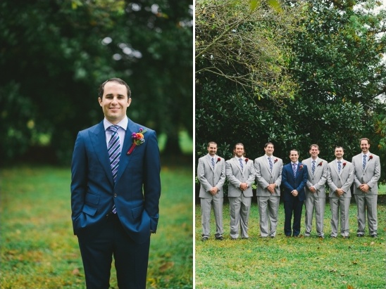 Groom in blue suit with groomsmen in gray suits