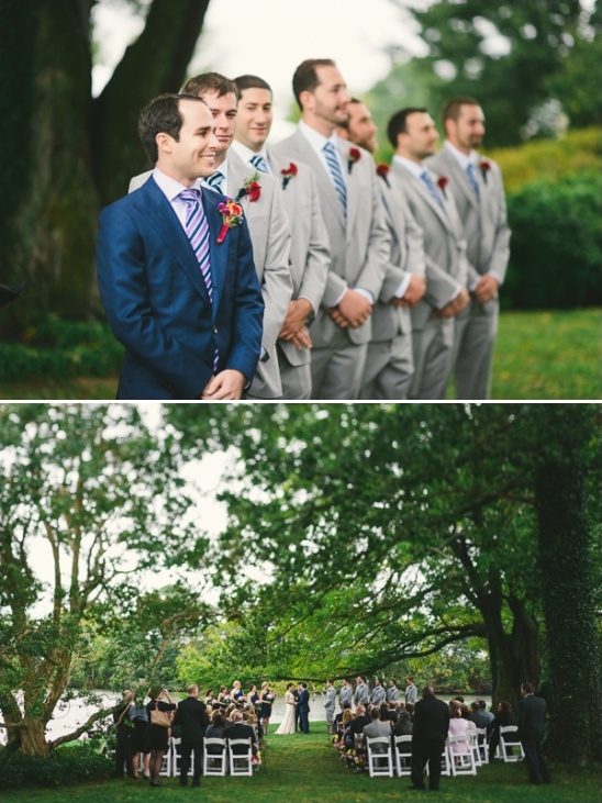Groomsmen in suits at outdoor wedding ceremony
