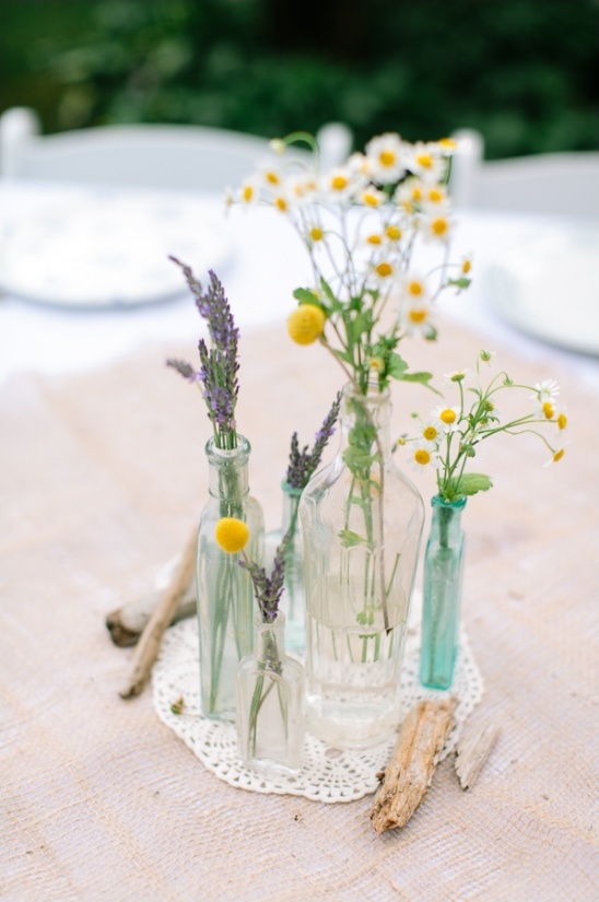 glass bottles with wild flowers