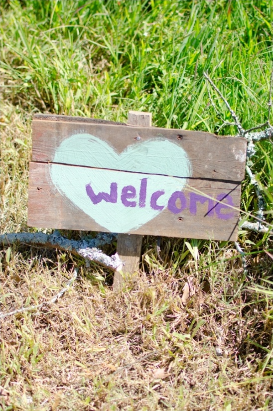 hand painted welcome sign