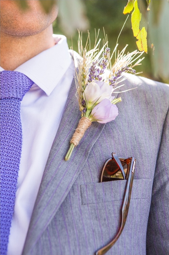 Grooms lavender boutonniere and sunglasses in suit pocket