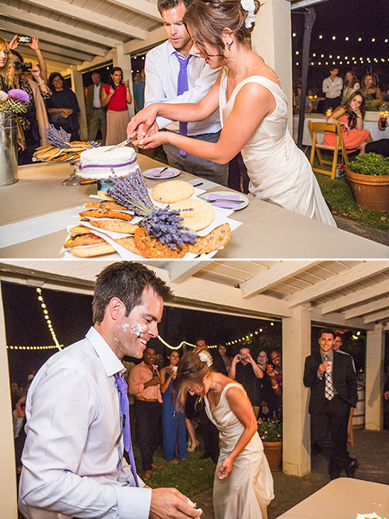 Couple cutting wedding cake, frosting fight