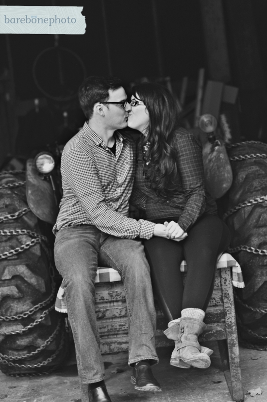 Couple kissing on tractor