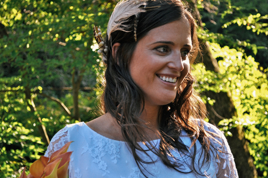 Smiling woman in light blue dress outdoors