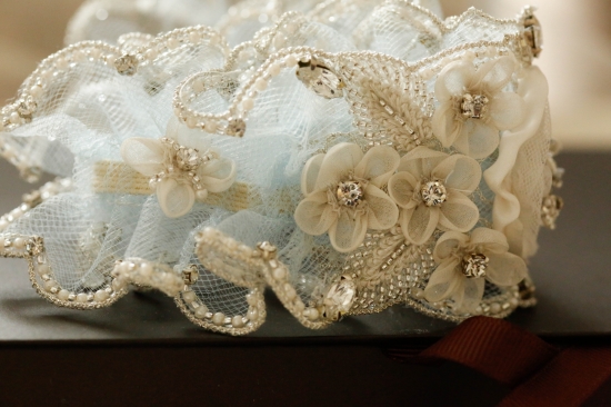 Delicate beaded lace bridal garter with flowers