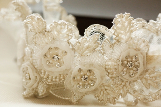 Elegant beaded lace bridal garter detail