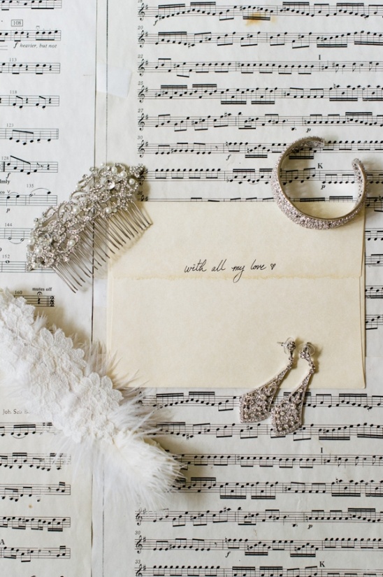 Wedding jewelry and note with message on sheet music
