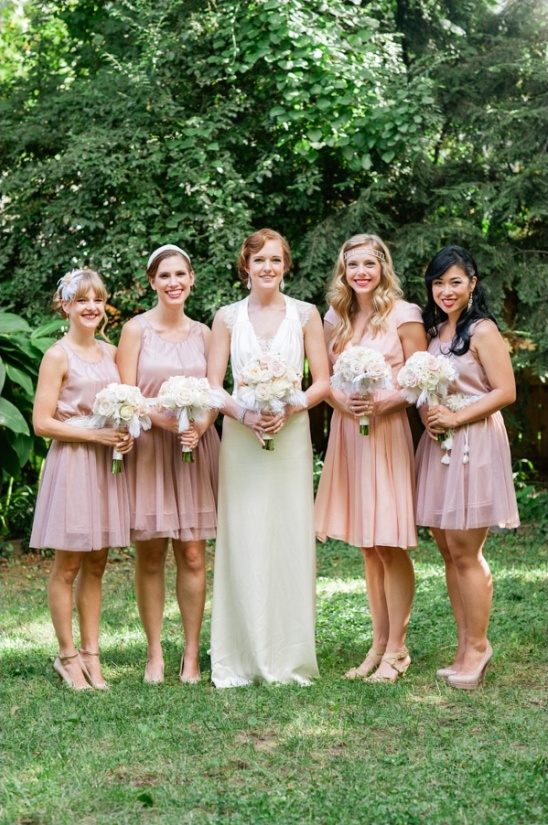 Bride and bridesmaids in blush dresses, outdoor wedding