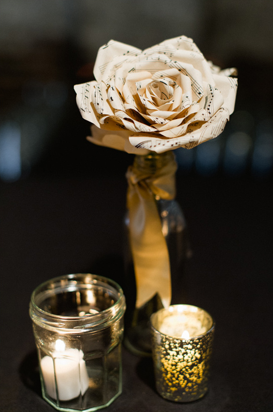 Music sheet rose centerpiece with candles decor