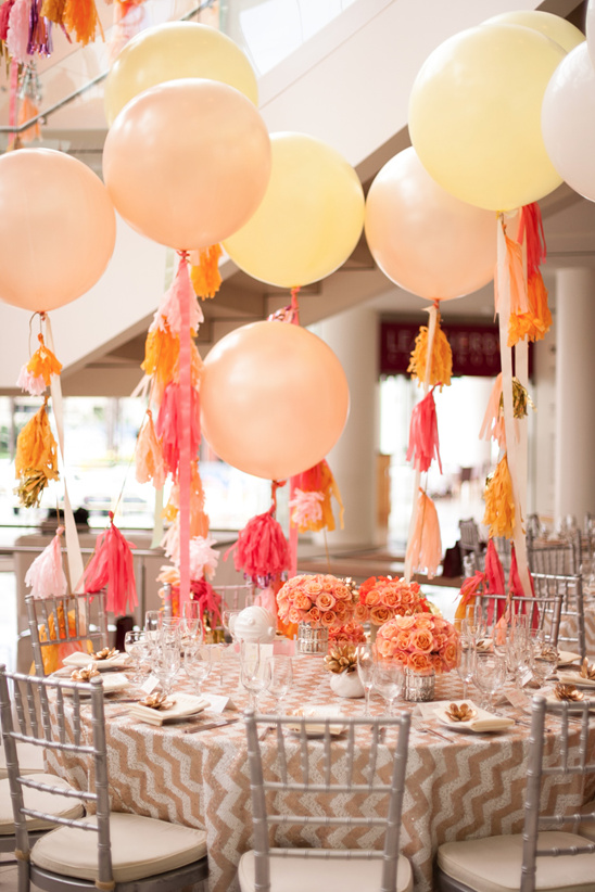 Pastel balloons and floral centerpieces wedding decor
