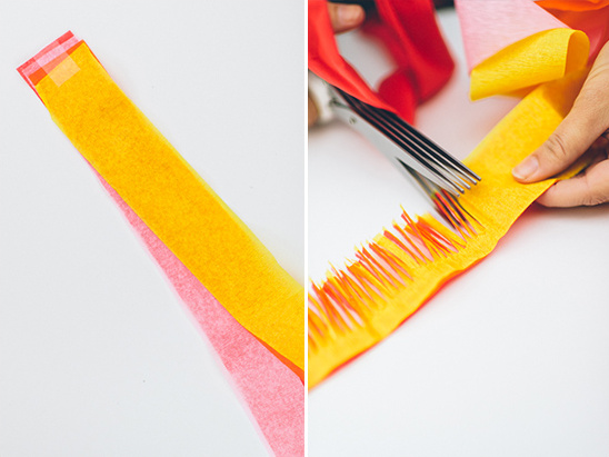 Cutting colorful crepe paper with fringing scissors