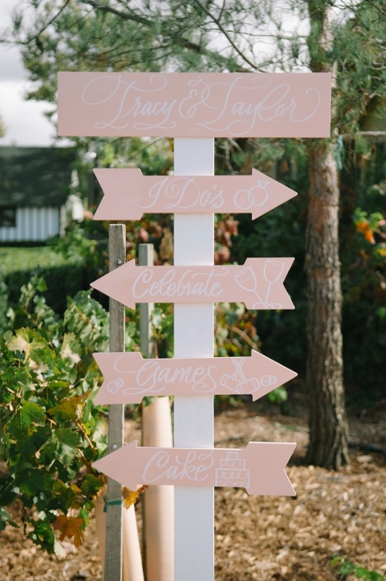 pink and white wedding sign