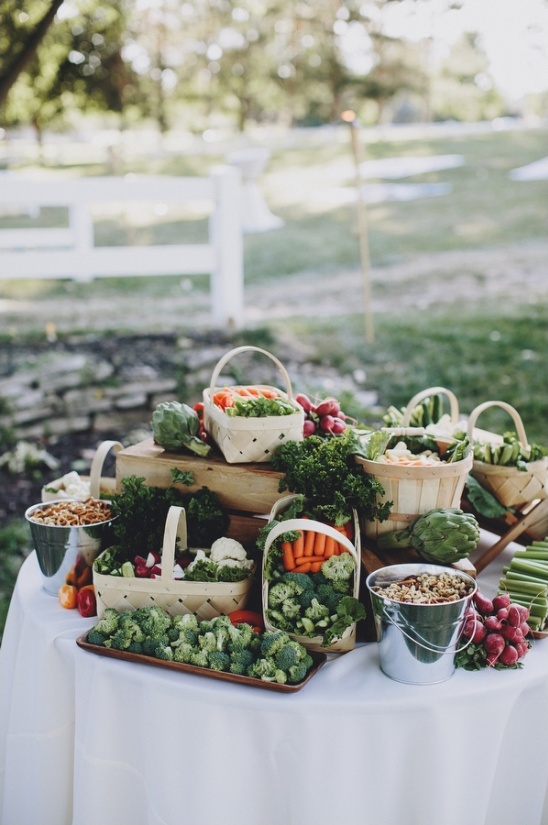 Vegetable platter on table with rustic baskets outdoors