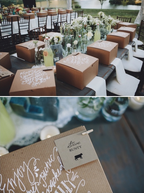 wedding place cards attached to gourmet picnic dinner boxes