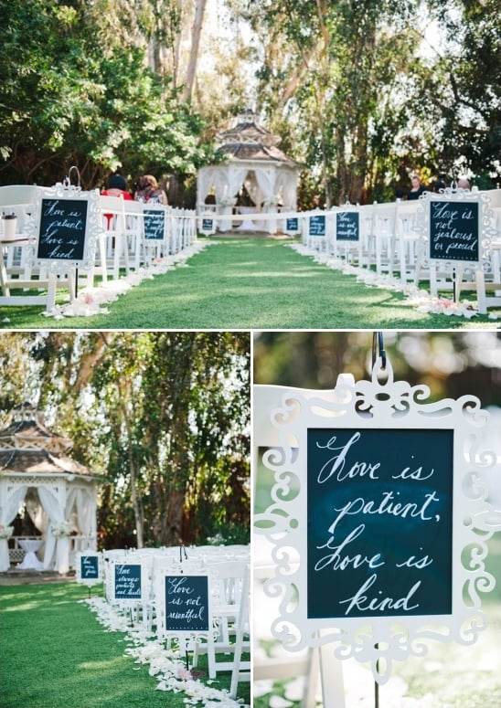 scripture written on chalkboard signs lining the ceremony aisle
