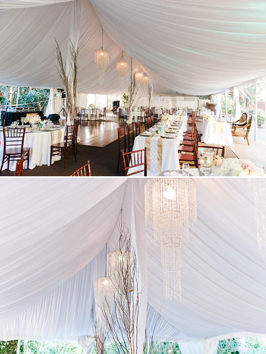 Elegant wedding tent reception with crystal chandeliers
