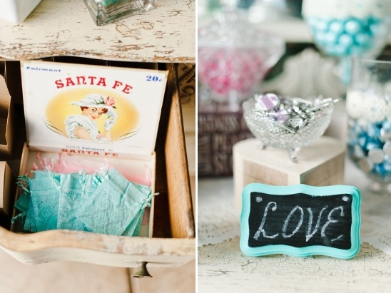 Vintage wedding favors and a love sign on display
