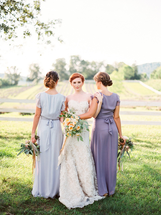 Wedding party in pastel bridesmaid dresses