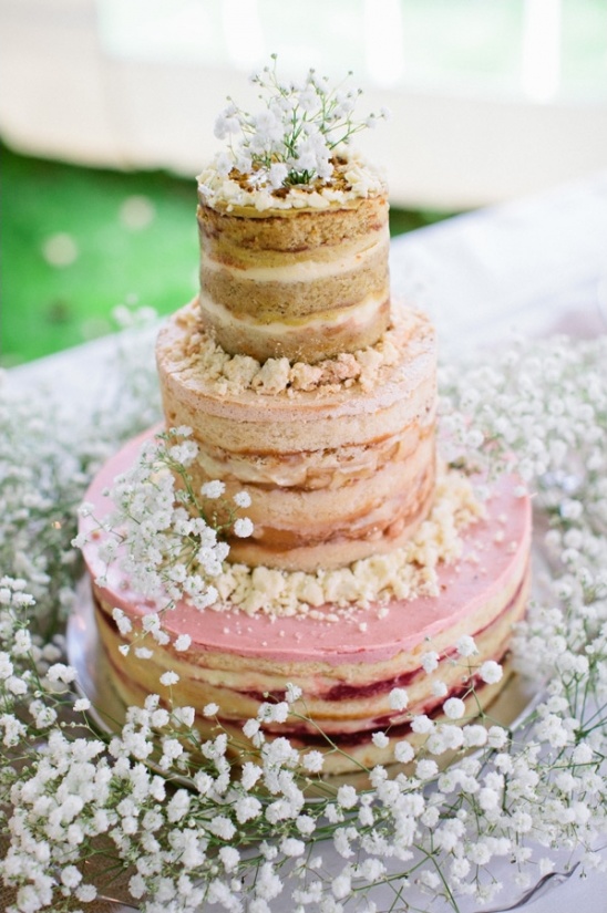 naked cake surrounded by babys breath