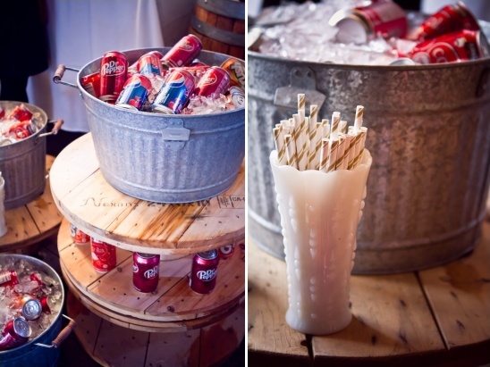 Rustic soda bar with ice buckets and straws in vase