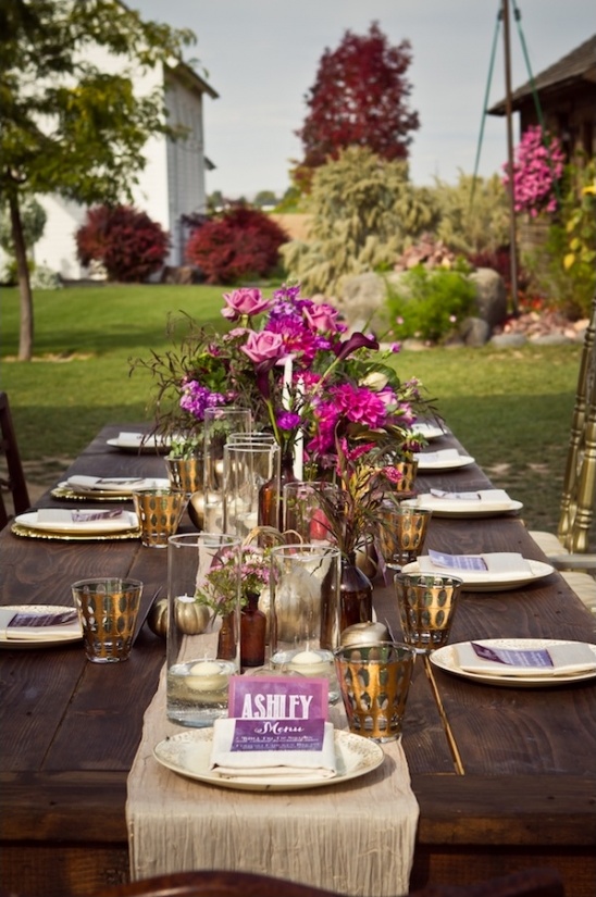 Outdoor wedding table setting with purple flowers
