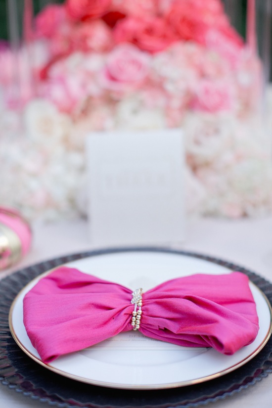 Pink napkin tied in bow, elegant wedding decor
